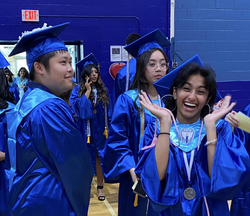 Graduates eagerly line up alphabetically as they prepare to walk the stage, commencing the last event of their high school careers.